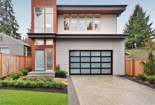 Contemporary Exterior of Home with exterior tile floors, exterior stone floors, Fence, Pathway