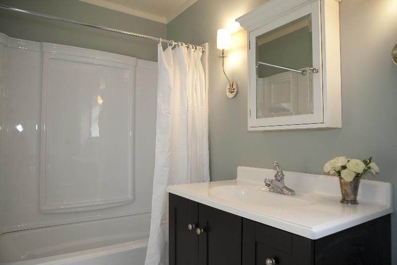 Contemporary Full Bathroom with Simple marble counters, partial backsplash, Crown molding, Simple Marble, Standard height