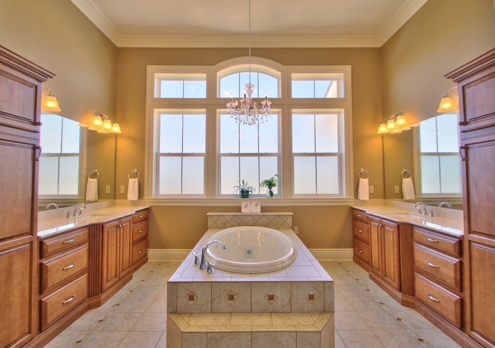 Traditional Master Bathroom with Master bathroom, Inset cabinets, Crown molding, Undermount sink, Bathtub, picture window