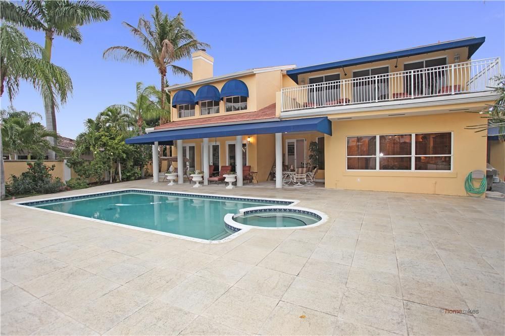 Mediterranean Swimming Pool with Casement, French doors, exterior tile floors, Deck Railing, exterior awning, Fence