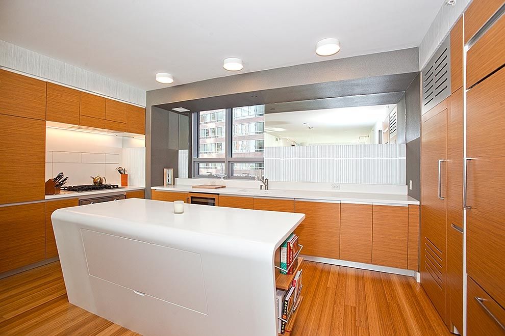 Contemporary Kitchen with Multiple Refrigerators, Built-in bookshelf, Undermount sink, Flush, European Cabinets, wall oven