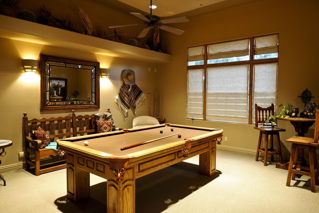 Southwestern Game Room with Pool table, can lights, Paint, Wall sconce, Carpet, Ceiling fan, Casement, Standard height