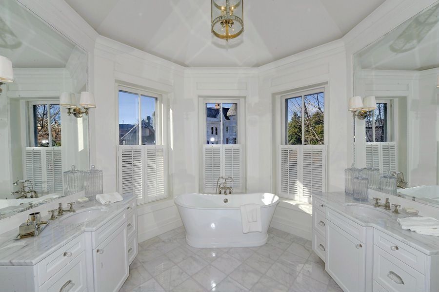 Traditional Master Bathroom with Hudson Valley Rockville Polished Nickel One-Light Wall Sconce, Framed Partial Panel, Bathtub