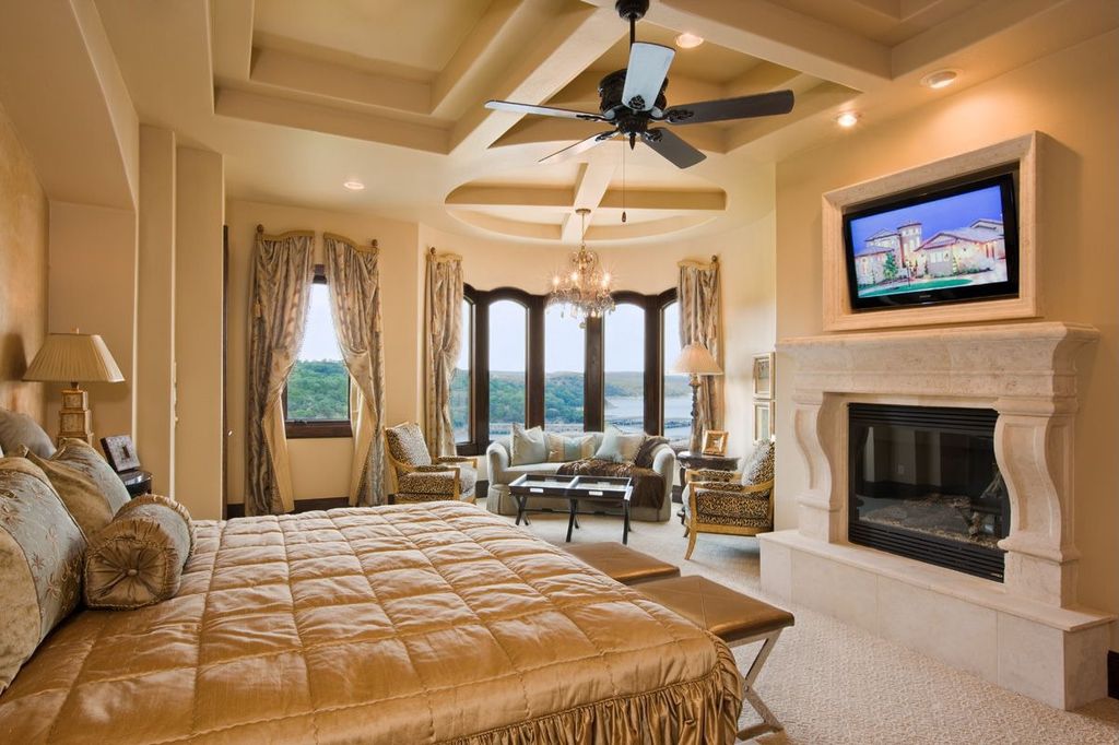 Modern Master Bedroom with picture window, Exposed beam, Carpet, Ceiling fan, Darcy cross-leg tufted brown leather bench