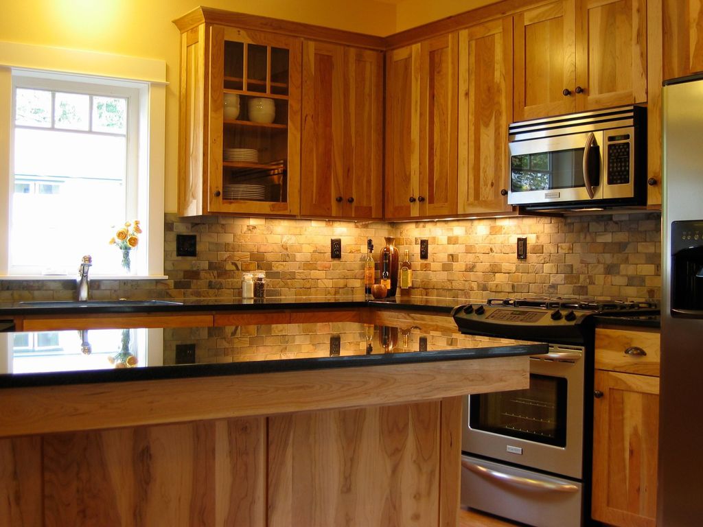 Craftsman Kitchen with built-in microwave, Built In Refrigerator, Stone Tile, Simple granite counters, High ceiling, L-shaped