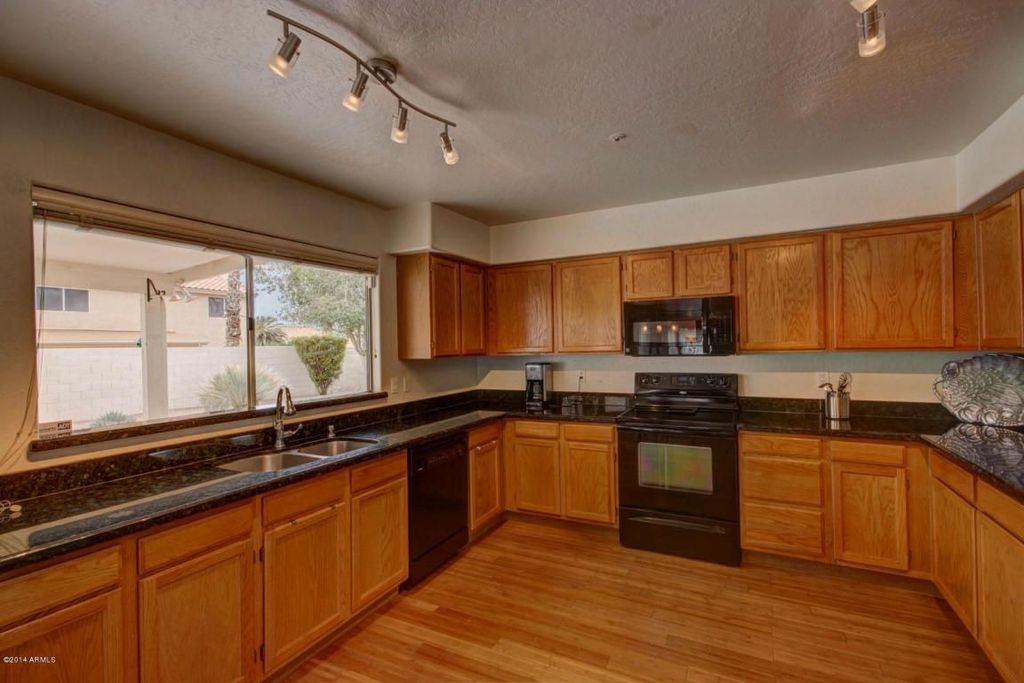 Craftsman Kitchen with U-shaped, Standard height, Casement, partial backsplash, Simple Granite, Flat panel cabinets