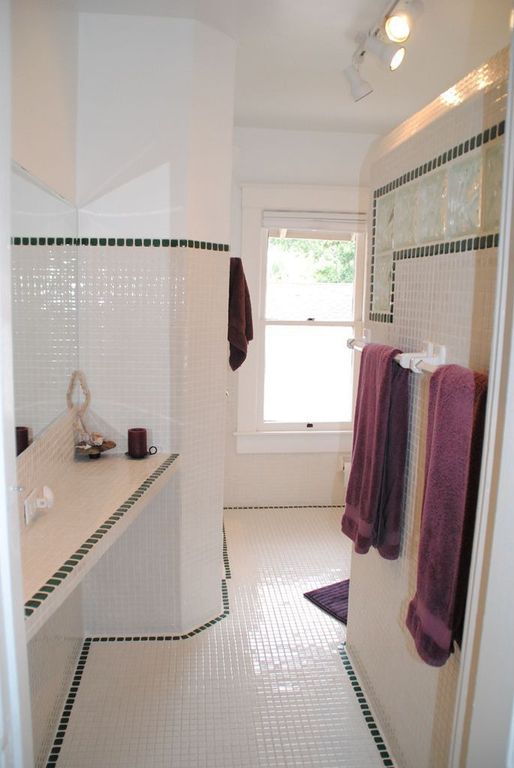 Traditional Full Bathroom with Daltile arctic white (2) d617 1x1 mosaic, Track lighting, double-hung window, Mosaic tile