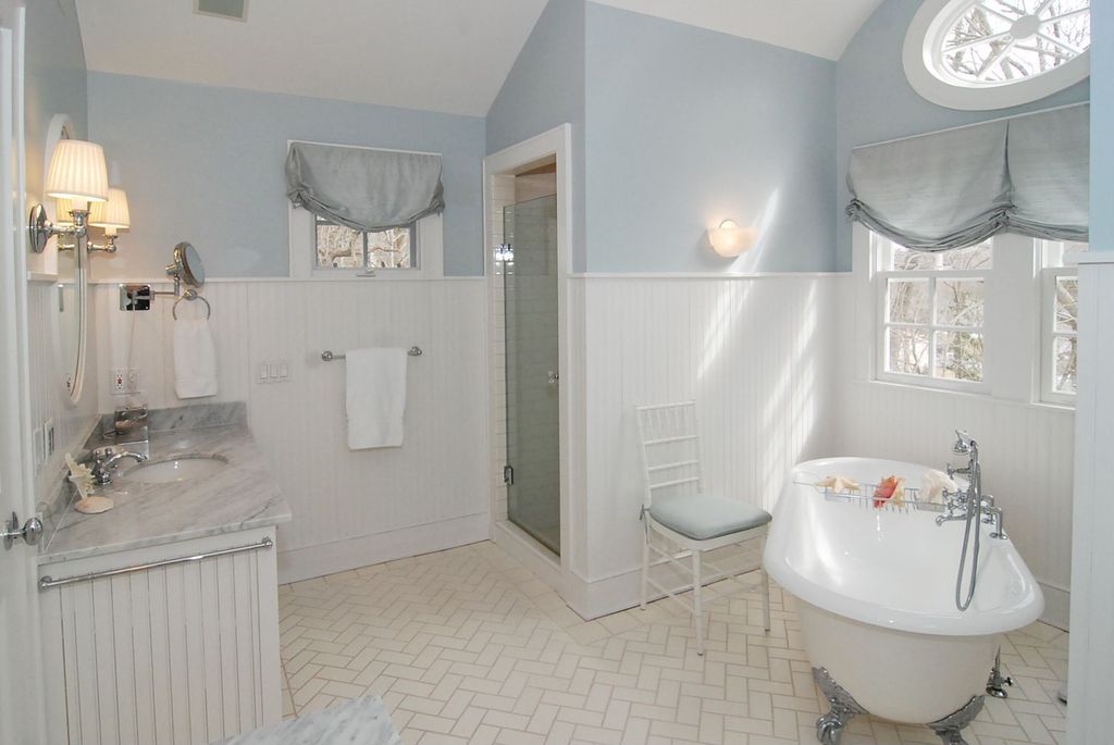Traditional Full Bathroom with Beadboard wainscoting, Signature hardware ralston cast iron clawfoot tub - imperial feet