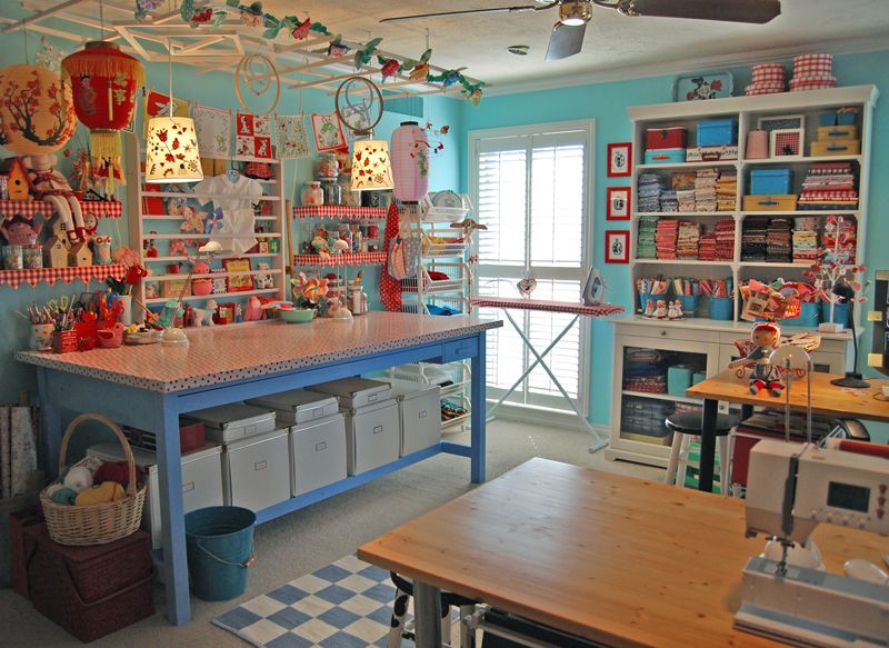 Eclectic Home Office with Pendant light, Container store bigso bold box white, Built-in bookshelf, Carpet, Ceiling fan