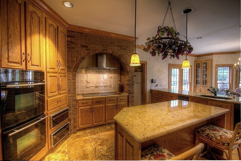 Traditional Kitchen with warming oven, Oregon Tile & Marble Astoria Cream Granite, complex granite tile floors, Crown molding