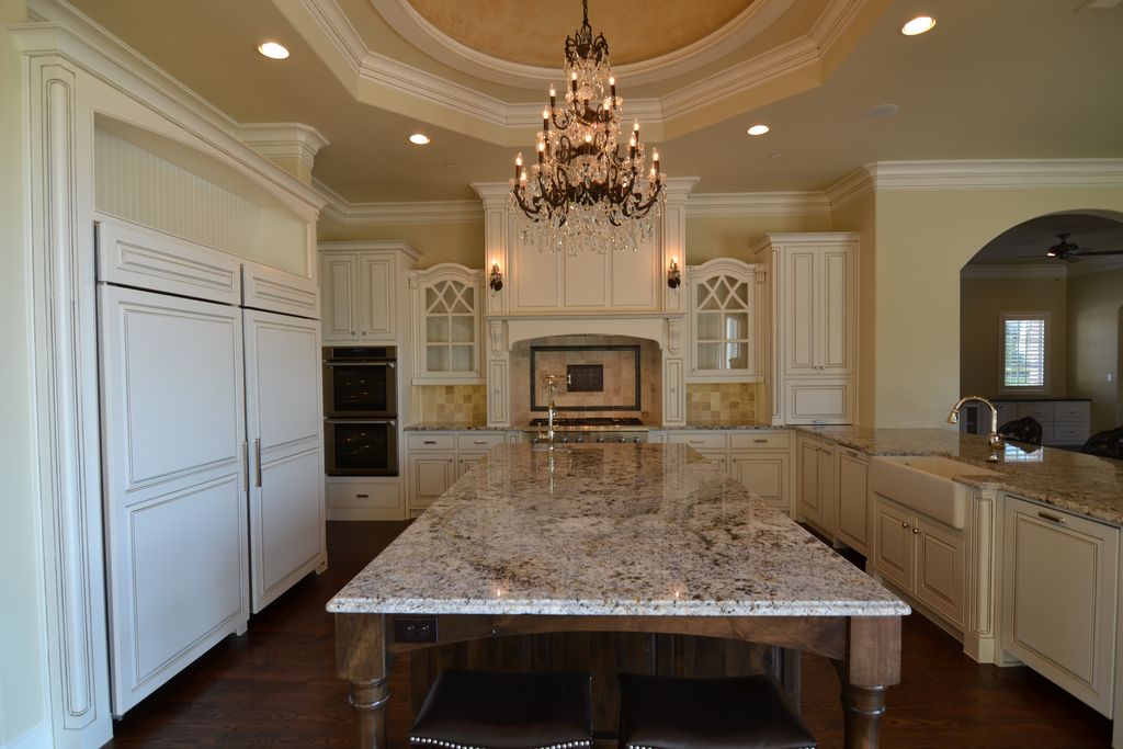 Traditional Kitchen with Glass panel, full backsplash, Built In Panel Ready Refrigerator, Custom hood, Kitchen island
