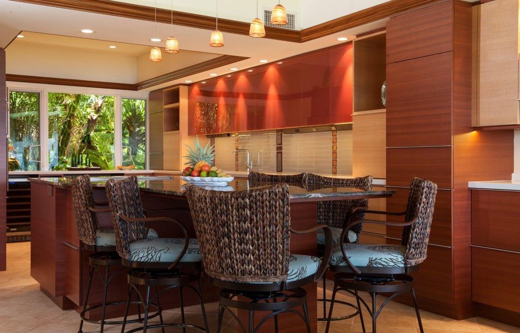 Tropical Kitchen with Breakfast nook, Casement, can lights, Complex marble counters, Kitchen island, full backsplash, Flush