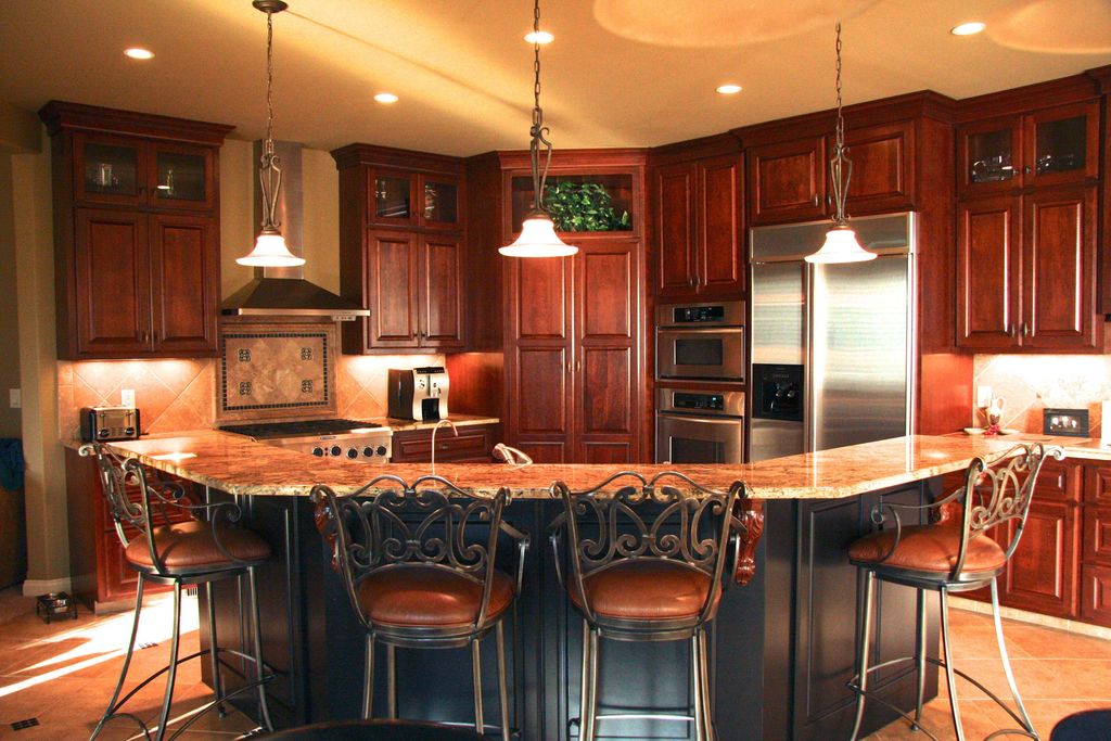 Traditional Kitchen with Inset cabinets, Raised panel, L-shaped, Stone Tile, Wall Hood, Glass panel, double wall oven