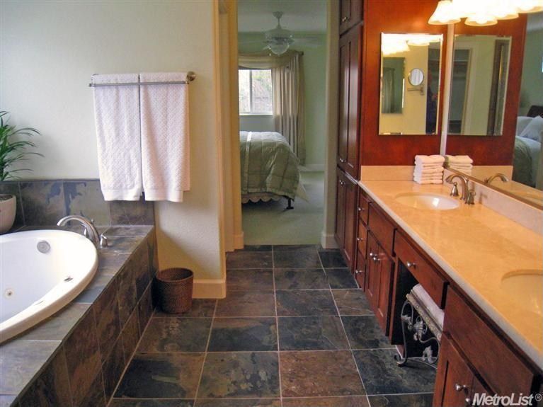 Traditional Master Bathroom with Wall Tiles, full backsplash, Undermount sink, Double sink, stone tile floors, Bathtub