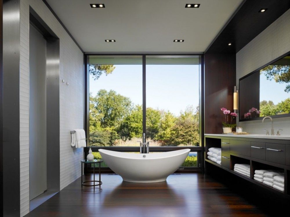 Contemporary Master Bathroom with Undermount sink, Wall sconce, European Cabinets, Freestanding bathtub, picture window