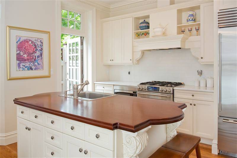Traditional Kitchen with Breakfast bar, Kitchen island, Custom hood, Flush, Simple marble counters, Multiple Refrigerators