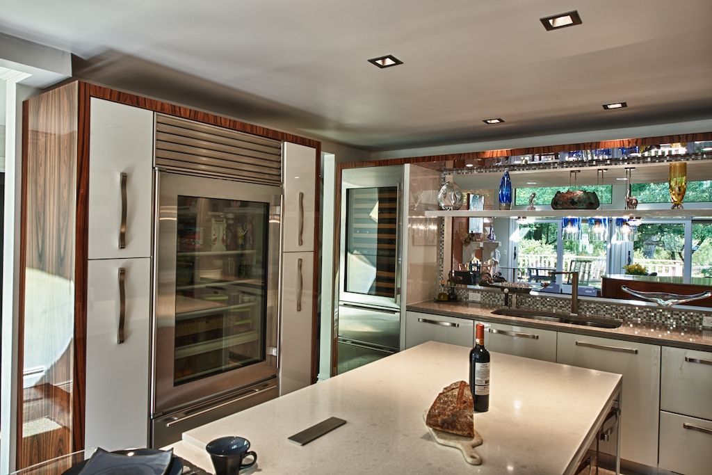 Contemporary Kitchen with European Cabinets, Wine refrigerator, Quartz counters, Casement, partial backsplash, L-shaped