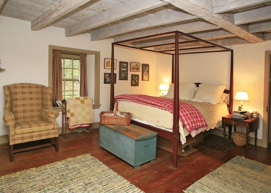 Country Master Bedroom with Standard height, Exposed beam, Hardwood floors, double-hung window