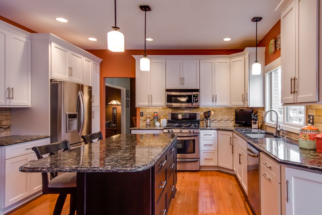 Traditional Kitchen with TUMBLED STONE 3X6 SUBWAY - TUSCANY IVORY, Standard height, gas range, Paint 1, can lights, U-shaped