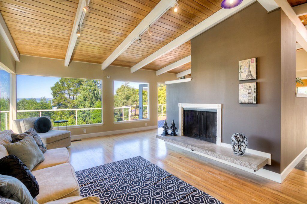 Traditional Living Room with Standard height, picture window, Fireplace, Paint, Pendant light, Exposed beam, flush light