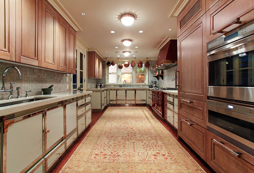 Traditional Kitchen with Galley, wall oven, double-hung window, Slate Tile, Stone Tile, Built In Panel Ready Refrigerator