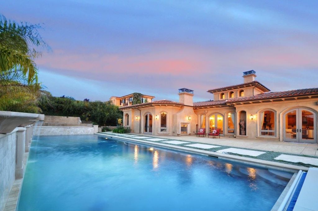 Mediterranean Swimming Pool with exterior tile floors, French doors, Arched window, Pathway, exterior concrete tile floors