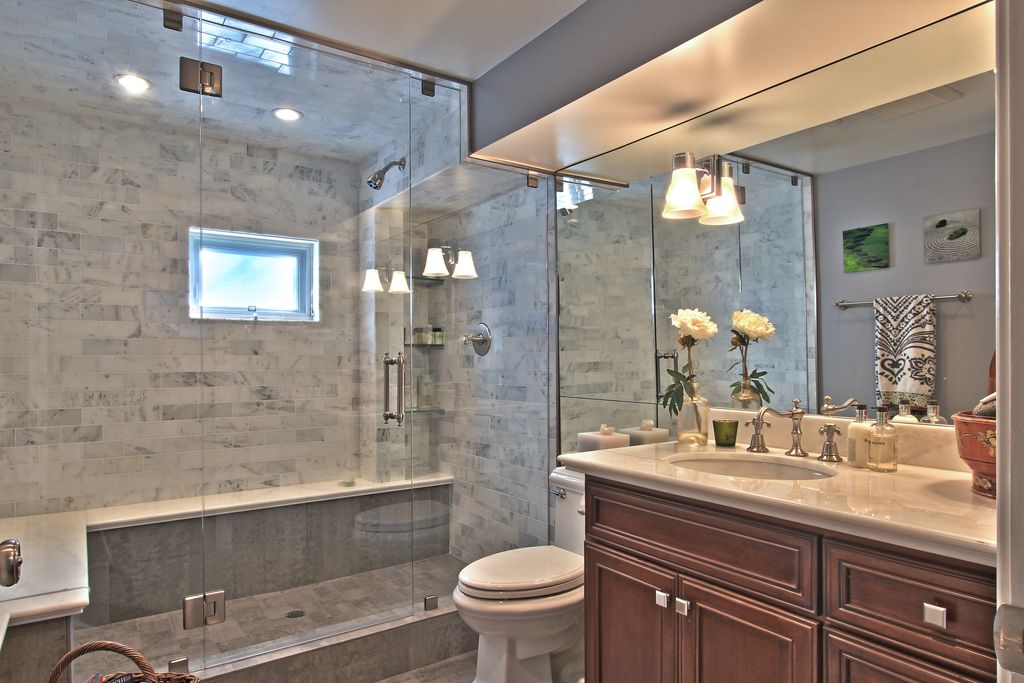 Traditional 3/4 Bathroom with Ms International Crema Marfil Classic Marble Countertop, can lights, flush light, Shower