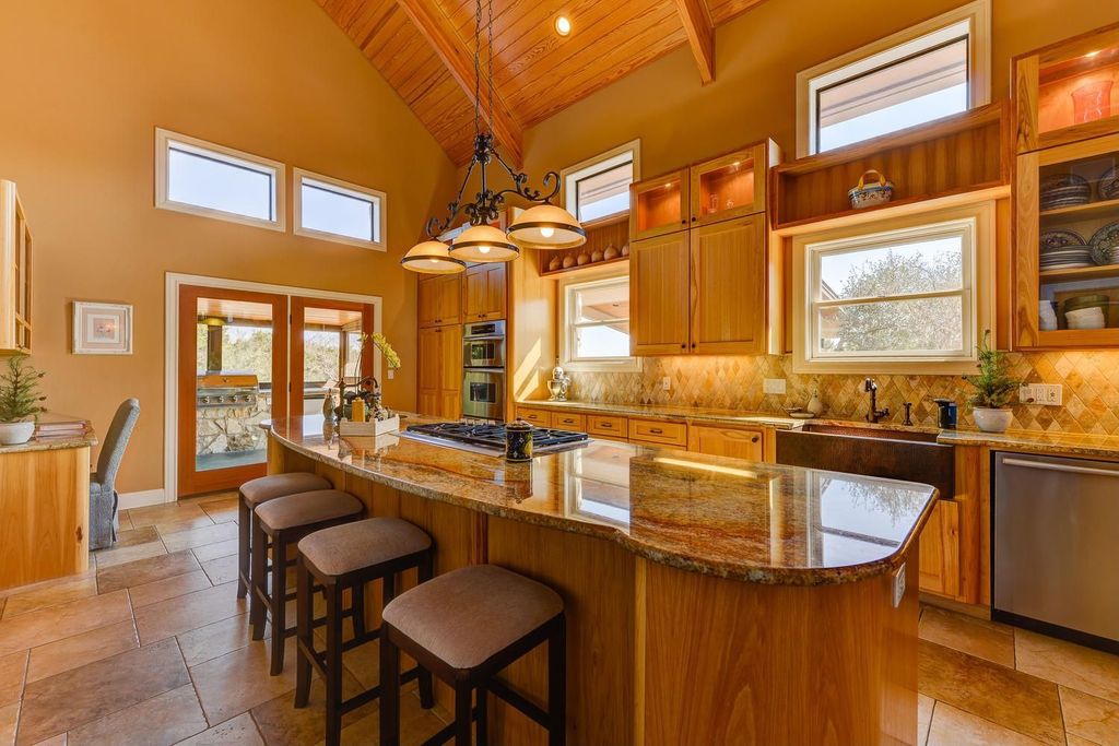 Traditional Kitchen with Limestone Tile, Kitchen island, double wall oven, Flush, stone tile floors, dishwasher, can lights