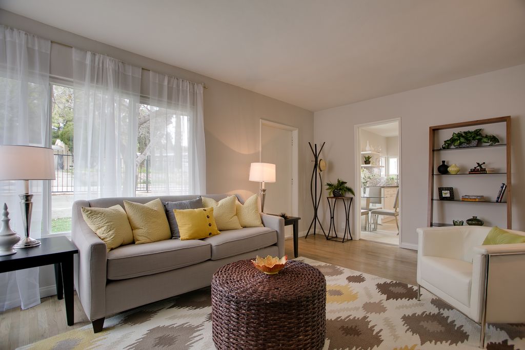 Contemporary Living Room with Carpet, West Elm Paidge Sofa, Hardwood floors, Riverside Home Office Leaning Bookcase